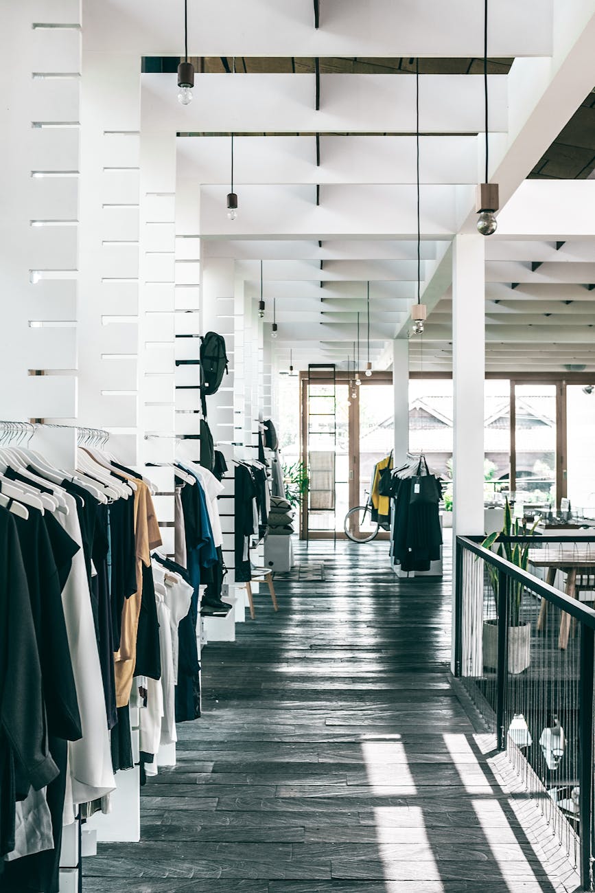 fashion store interior with garments hanging on racks